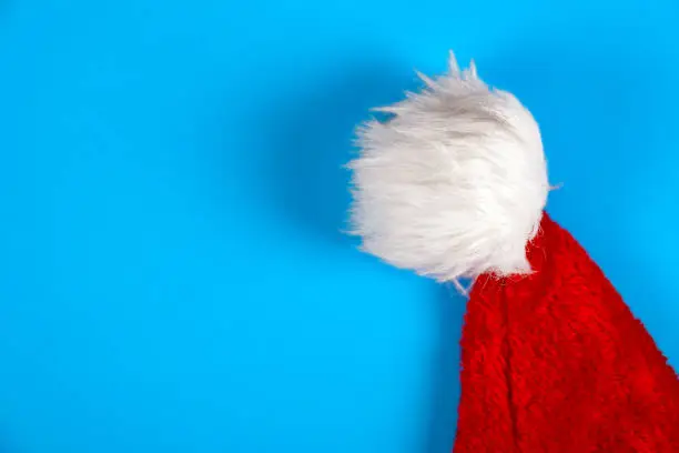 Santa Hat on the Blue Background closeup