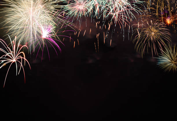 istock Colorful fireworks on black background with bokeh. New year celebration concept 1355229409