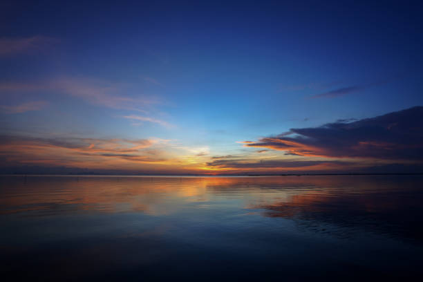 istock The twilight sky with star after sunset at the lake. 1355230220