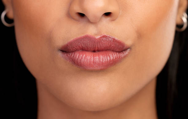 istock Closeup studio shot of an unrecognizable young woman's lips 1355234294