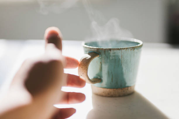 Japanese man about to taking a coffee cup in the morning.