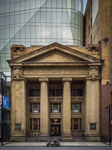 Low angle view of old and new buildings with blue sky