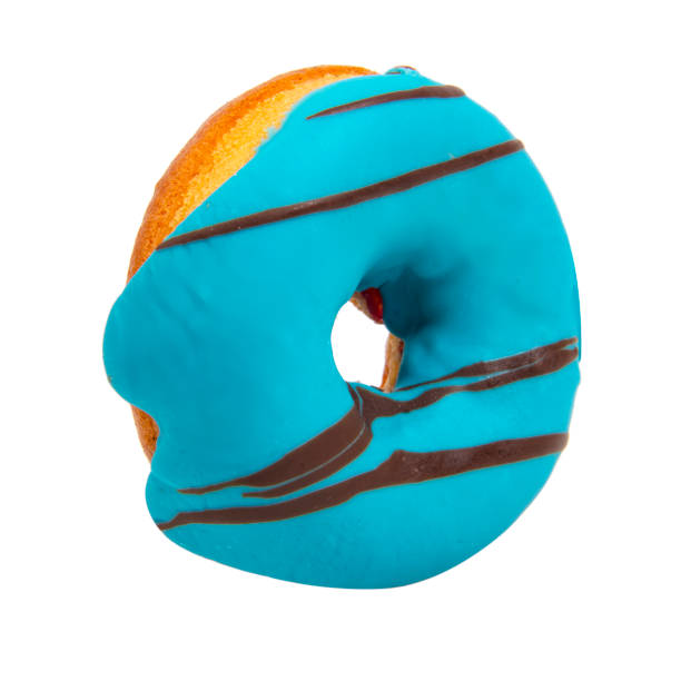 istock Tasty glazed blue donut isolated on the white background 1355237635