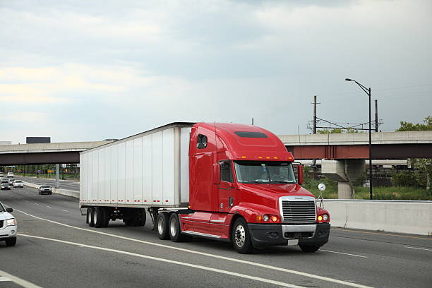 istock Long Distance Tractor Trailer on the Road 135523796