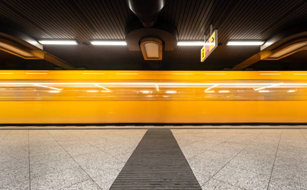 istock Blurred Motion Of Train At Subway Station 1355238616
