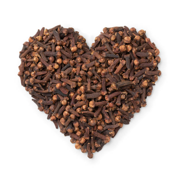 Dried cloves in heart shape isolated on white background
