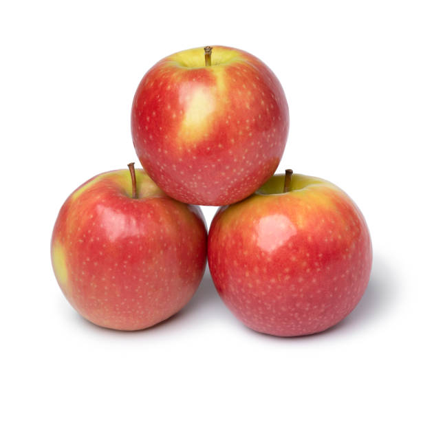 istock Fresh healthy Pink Lady apples on white background 1355239386