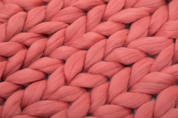 istock close-up knitted coral wool from natural wool 1355240696