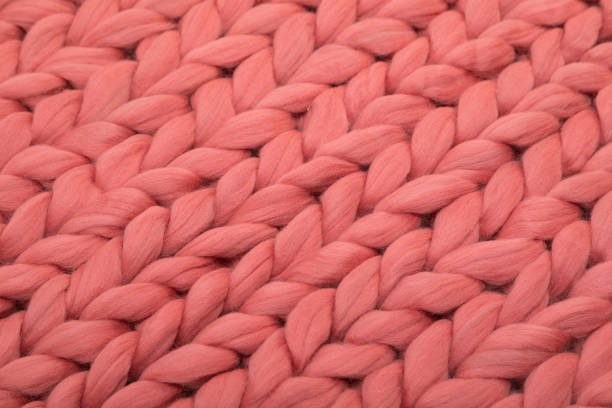 istock plaid from natural sheep wool close-up coral color 1355240752
