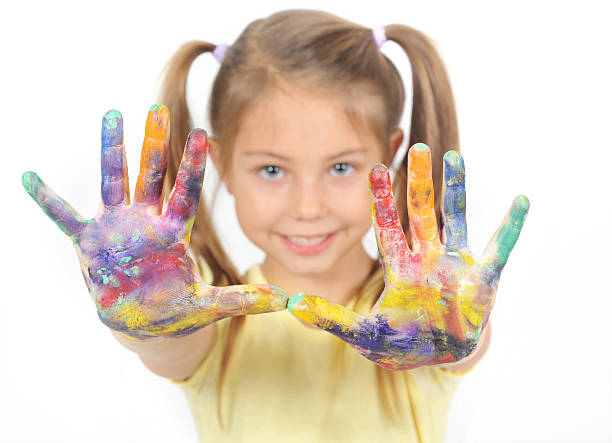 istock Little girl with her hands painted 135524225