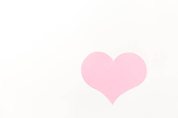 istock a large pink heart with a place for text on a white background 1355243097