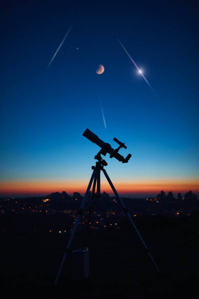 istock Astronomical telescope under a twilight sky ready for stargazing. 1355243407