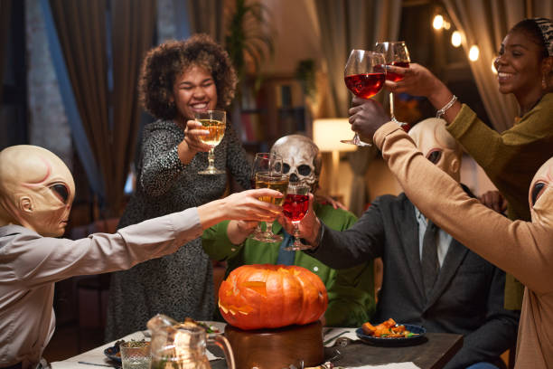 istock Friends drinking wine at party 1355243489