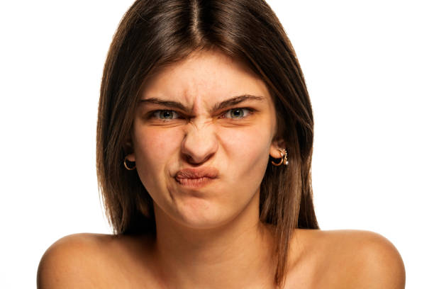 istock A young frowning girl with blue eyes 1355244784
