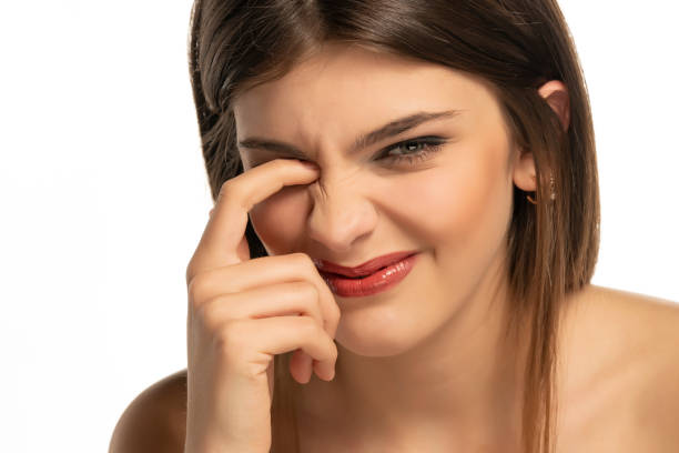 istock woman scratches her itchy eye 1355244817