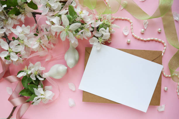 istock spring greeting card. frame from flowering branches with white flowers. space for text 1355244915
