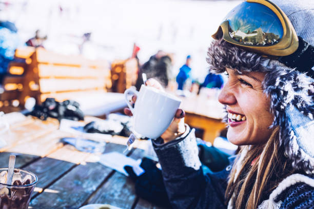 young happy woman enjoying in hot tea at ski resort. - estância de esqui imagens e fotografias de stock