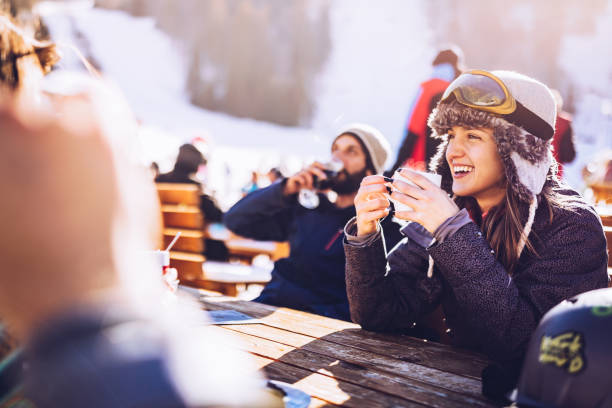 istock Happy friends communicating on a break from skiing in a cafe. 1355244991