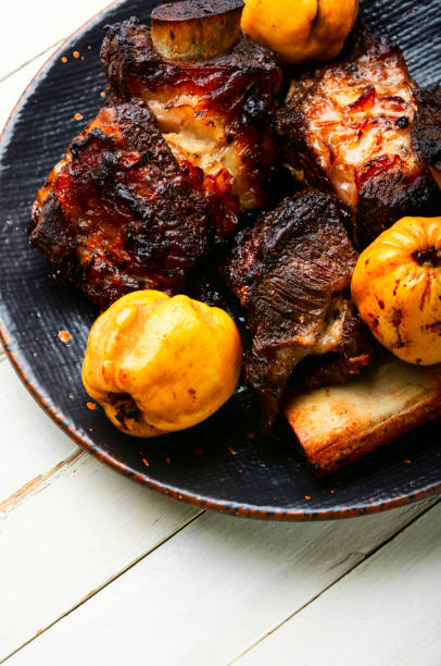 istock Roasted beef rib with quince. 1355248076