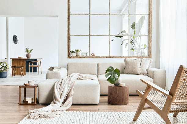 istock Modern interior of open space with design modular sofa, furniture and elegant personal accessories in stylish home decor. Neutral living room. Template. 1355249436