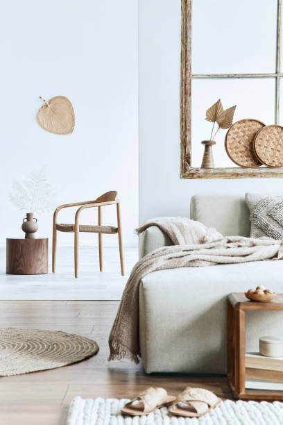 istock Modern interior of open space with design modular sofa, furniture and elegant personal accessories in stylish home decor. Neutral living room. Template. 1355249437