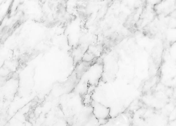 istock White marble texture background pattern top view. Tiles natural stone floor with high resolution. Luxury abstract patterns. Marbling design for banner, wallpaper, packaging design template 1355250440