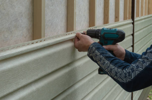 istock finishing a country house with siding 1355250533