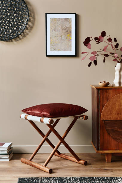 istock Stylish interior with design wooden commode, mock up poster frame and elegant personal accessories. Modern living room in classic house. 1355250663