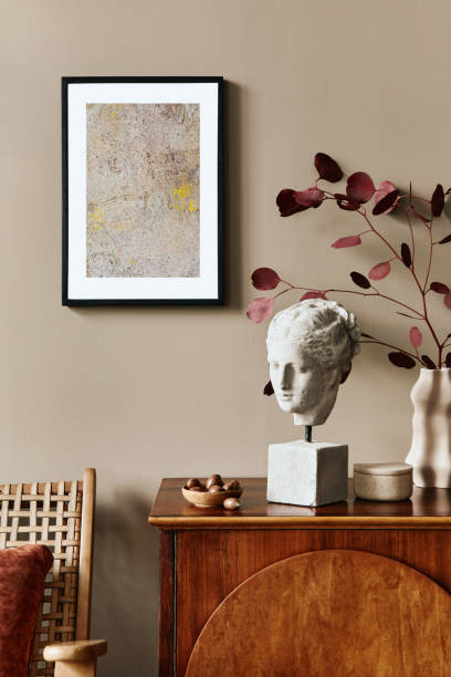 istock Stylish interior with design wooden commode, mock up poster frame and elegant personal accessories. Modern living room in classic house. 1355250710