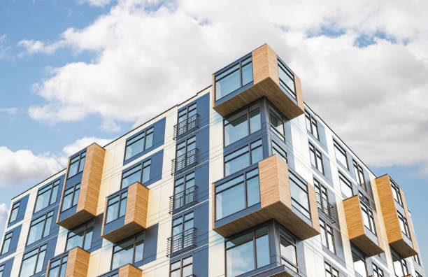 istock Modern residential building on a sunny day with a blue sky. 3d illustration 1355251068