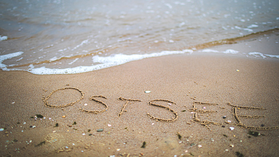 German word for Baltic Sea written in the sand by the sea