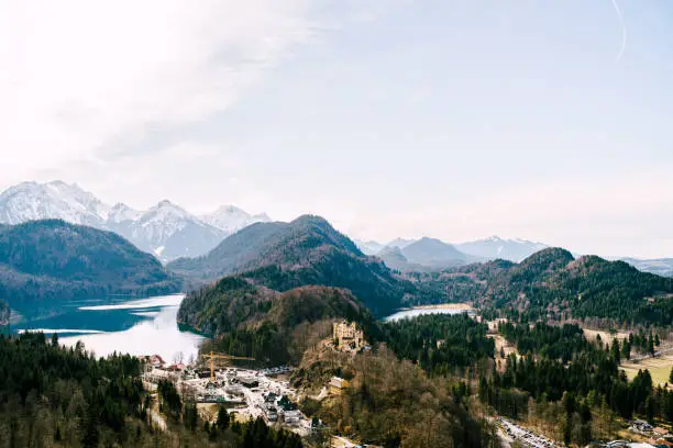 Hohenschwangau Castle in the forest among the mountains. Panorama. High quality photo