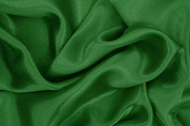 istock Dark green fabric texture background, detail of silk or linen pattern. 1355253589