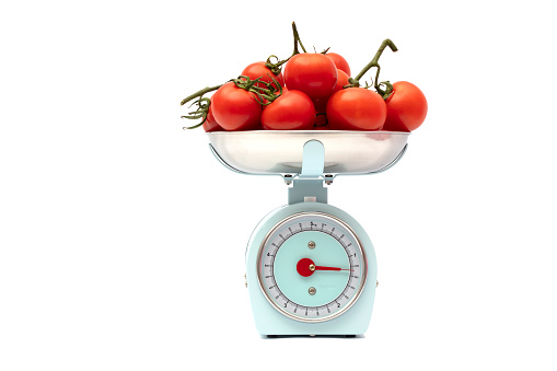 Tomato weight scale isolated on white