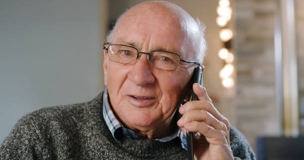 istock Shot of a senior man using a phone at home 1355259790