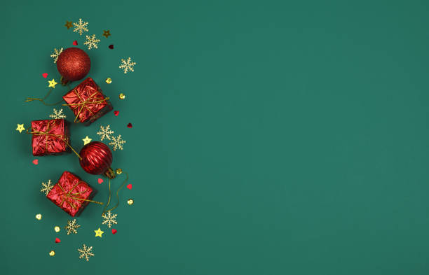 istock Christmas red decorations on green background with copy spacefor text 1355262738