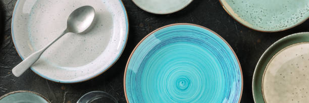 istock Modern tableware panorama with a blue plate. Elegant catering banner 1355263925