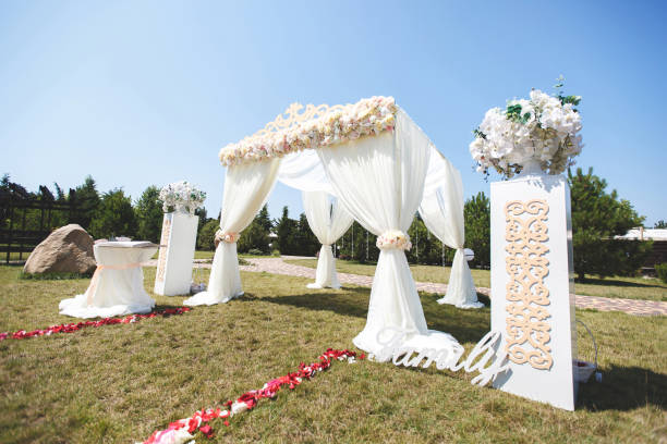 istock White wedding tent for the ceremony outdoors. Arch. Chairs. 1355264021
