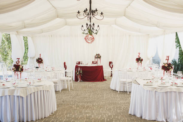 istock Beautiful Banquet hall under a tent for a wedding reception. 1355264651