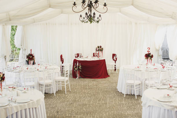 istock Beautiful Banquet hall under a tent for a wedding reception. 1355264724
