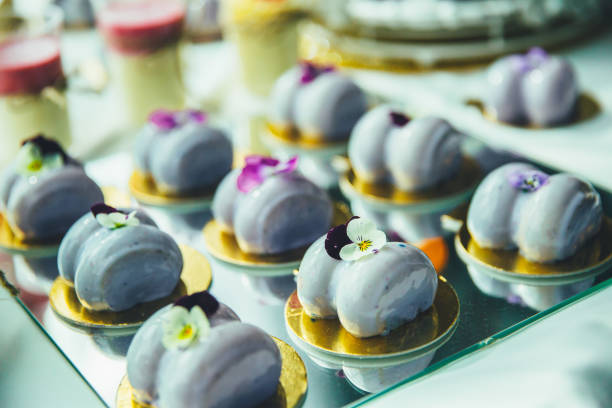 istock purple mousse cakes on a mirrored tray 1355266209
