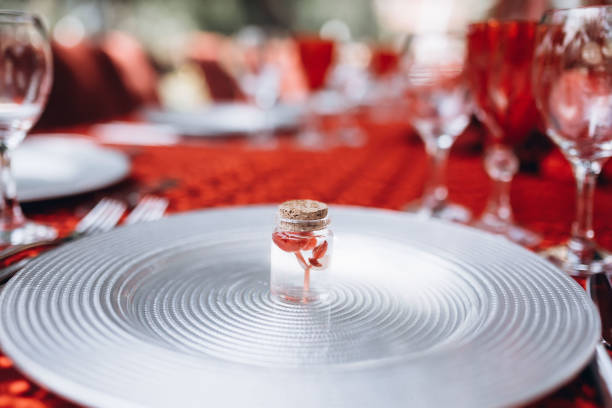 istock red flower in a transparent small jar 1355266285