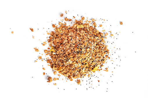 Granola from whole oat flakes with coconut chips, pineapple and chia seeds isolated on a white background. Muesli isolated. A quick breakfast. Healthy breakfast. High quality photo