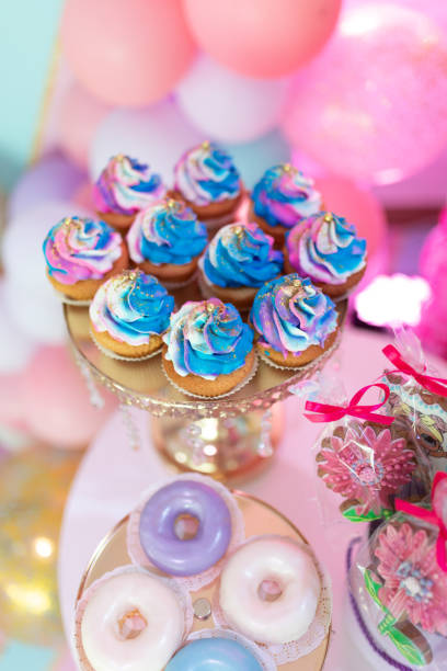 istock blue cupcakes on a golden tray 1355266776