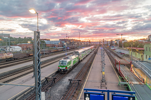 Turku, Finland - August 5, 2021: Beautiful sunrise view on railway track in Turku.