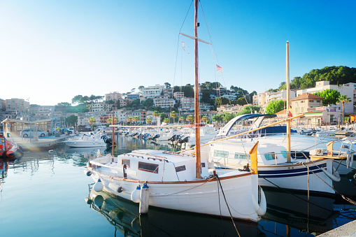 view of Port Soller harbour with yachts, summer vacations at Mallorca island, toned