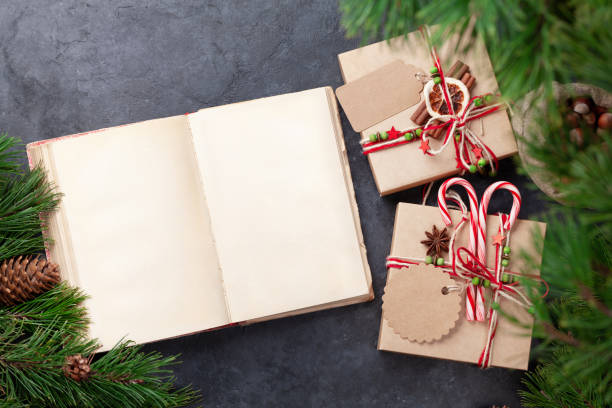 istock Christmas gift box with craft decor and vintage book 1355271332