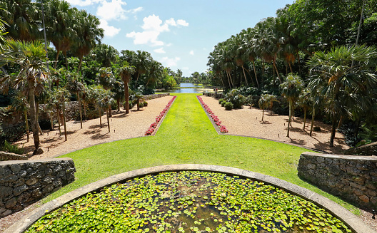 Coral Gables, Florida, USA - May 31, 2021:   Aerial view of Fairchild Tropical Botanic Garden.  Fairchild is a world premier public tropical garden with the largest collection of palm and cycads in 83 acres.