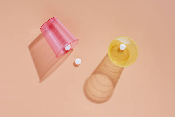 istock Medical pills and glasses 1355276136