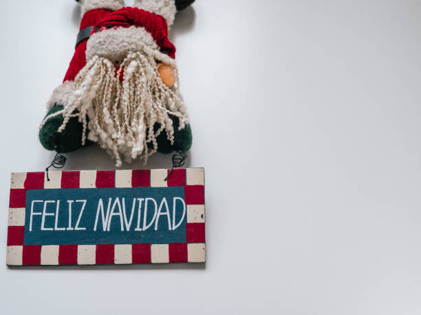 istock Poster Merry Christmas in spanish and doll.Copy space 1355280358